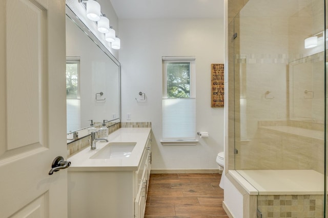 5801 Fox Chapel Dr, Austin, TX 78746 - bathroom with a stall shower, toilet, plenty of natural light, and vanity