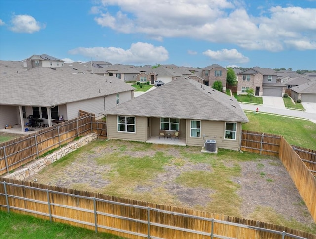 6100 Shanjia Dr, Austin, TX 78724 - rear view of property featuring a residential view, a patio area, central AC, a fenced backyard, and a shingled roof