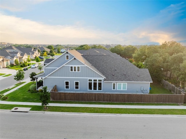 817 Craven Hill Ln, Leander, TX 78641 - rear view of house with board and batten siding and a residential view