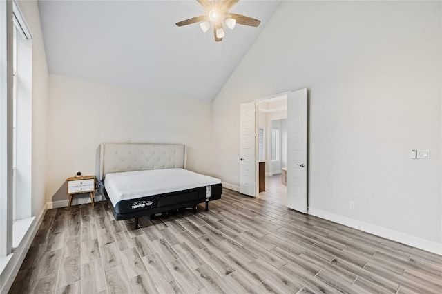 817 Craven Hill Ln, Leander, TX 78641 - bedroom featuring light wood-style flooring, baseboards, high vaulted ceiling, and a ceiling fan