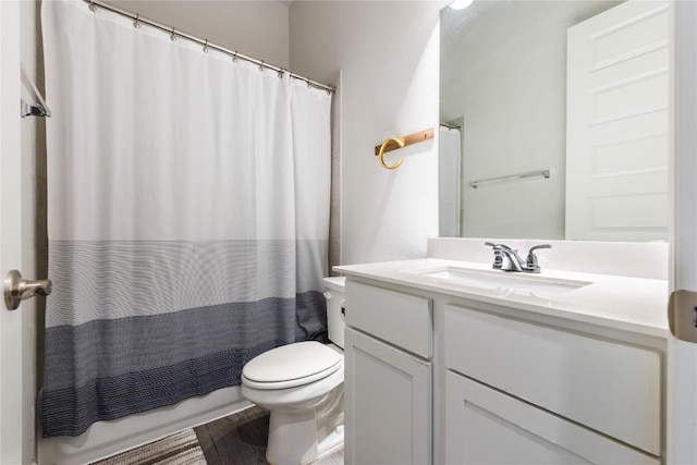 817 Craven Hill Ln, Leander, TX 78641 - bathroom with vanity, toilet, wood finished floors, and shower / bathtub combination with curtain
