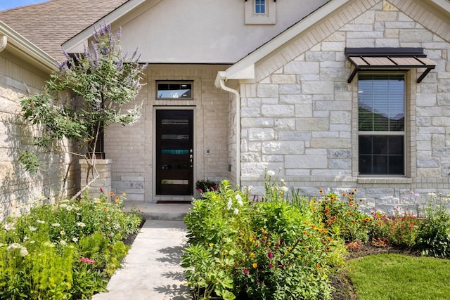 132 Lockhart Dr, Liberty Hill, TX 78642 - doorway to property with stone siding and roof with shingles