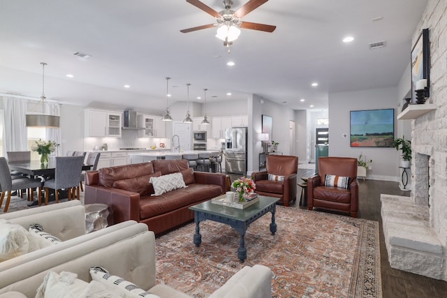 132 Lockhart Dr, Liberty Hill, TX 78642 - living room with dark wood-type flooring, healthy amount of natural light, a ceiling fan, and recessed lighting