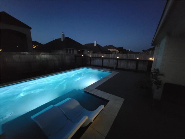 132 Lockhart Dr, Liberty Hill, TX 78642 - pool at twilight with a fenced backyard and a patio