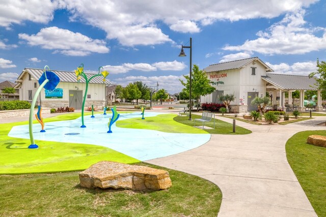 132 Lockhart Dr, Liberty Hill, TX 78642 - surrounding community with a lawn