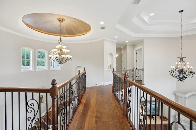 1353 Osprey Ridge Loop, Lago Vista, TX 78645 - corridor with a tray ceiling, an upstairs landing, a chandelier, wood finished floors, and recessed lighting