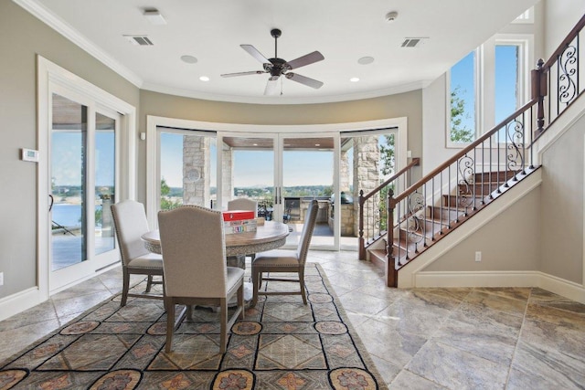 1353 Osprey Ridge Loop, Lago Vista, TX 78645 - dining room with stone tile floors, baseboards, crown molding, stairs, and recessed lighting