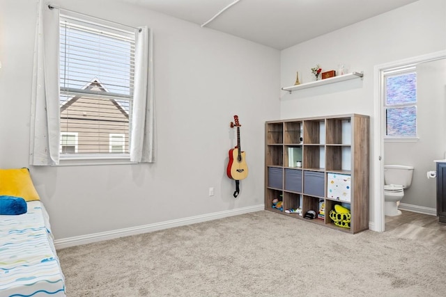 7818 Moody Bnd, Austin, TX 78744 - carpeted bedroom with baseboards and ensuite bath
