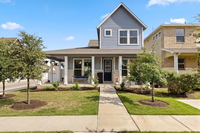 7818 Moody Bnd, Austin, TX 78744 - view of front facade with covered porch, a front lawn, and brick siding