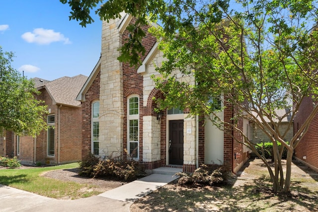 14812 Avery Ranch Blvd Unit 72, Austin, TX 78717 - view of front facade featuring roof with shingles, brick siding, and stone siding