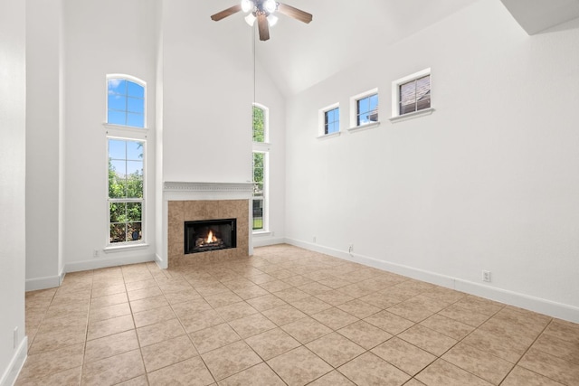 14812 Avery Ranch Blvd Unit 72, Austin, TX 78717 - unfurnished living room featuring high vaulted ceiling, ceiling fan, light tile patterned floors, a fireplace, and baseboards