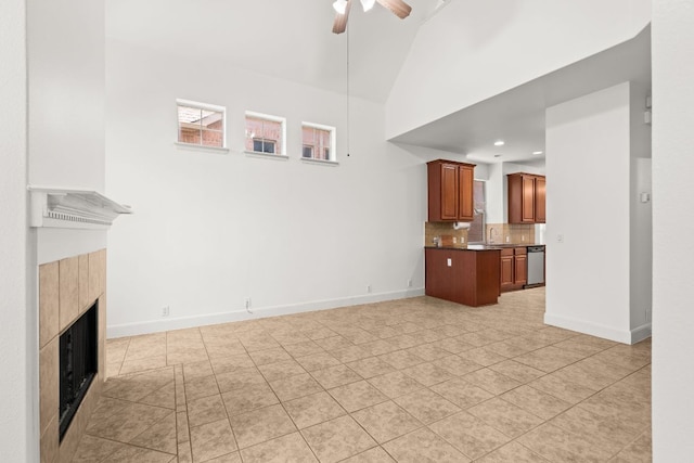 14812 Avery Ranch Blvd Unit 72, Austin, TX 78717 - unfurnished living room featuring a sink, a tile fireplace, ceiling fan, light tile patterned floors, and baseboards
