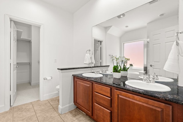14812 Avery Ranch Blvd Unit 72, Austin, TX 78717 - bathroom featuring double vanity, toilet, and tile patterned floors