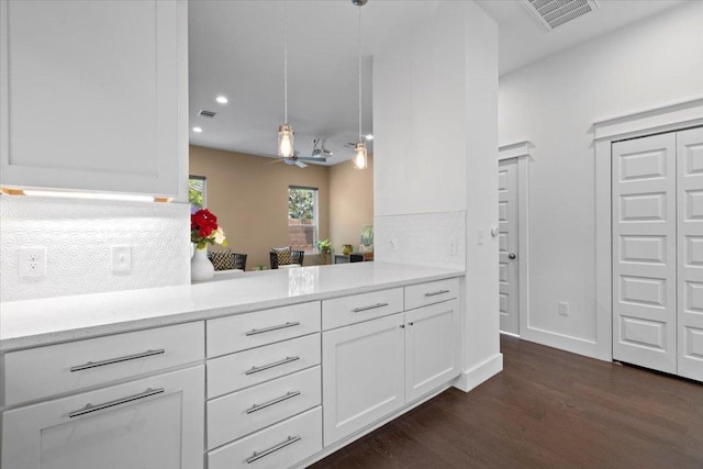 1500 Justin Ln Unit 2, Austin, TX 78757 - kitchen featuring dark wood-style flooring, white cabinetry, recessed lighting, ceiling fan, and pendant lighting