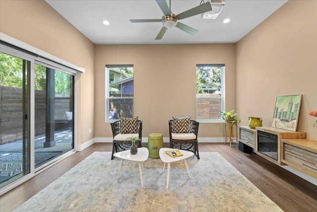 1500 Justin Ln Unit 2, Austin, TX 78757 - living area featuring wood finished floors, baseboards, recessed lighting, and ceiling fan