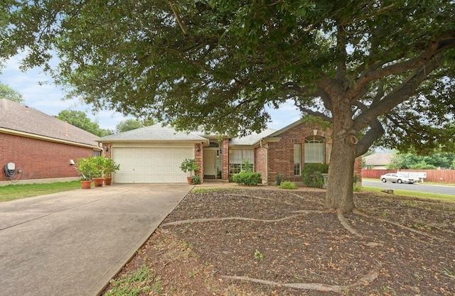 4600 Tello Path, Austin, TX 78749 - ranch-style house featuring concrete driveway, an attached garage, and brick siding