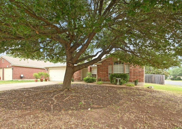 4600 Tello Path, Austin, TX 78749 - view of front of house featuring driveway, brick siding, and an attached garage