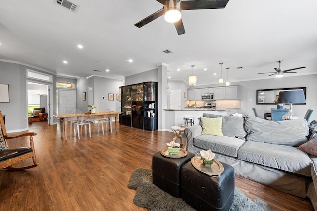 4600 Tello Path, Austin, TX 78749 - living area with a ceiling fan, crown molding, recessed lighting, wood finished floors, and baseboards