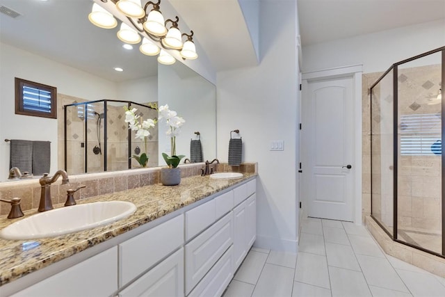 13601 Montview Dr, Austin, TX 78732 - full bathroom with tile patterned floors, a stall shower, and double vanity