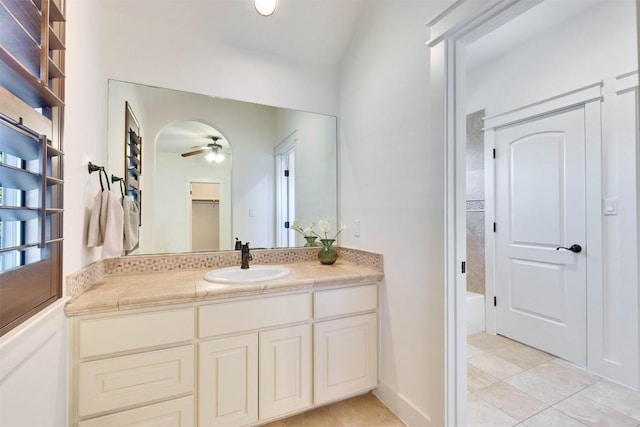 13601 Montview Dr, Austin, TX 78732 - bathroom featuring a ceiling fan, vanity, a bath, and tile patterned floors