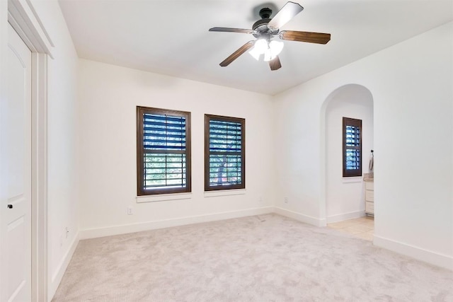 13601 Montview Dr, Austin, TX 78732 - empty room with light carpet, healthy amount of natural light, and baseboards