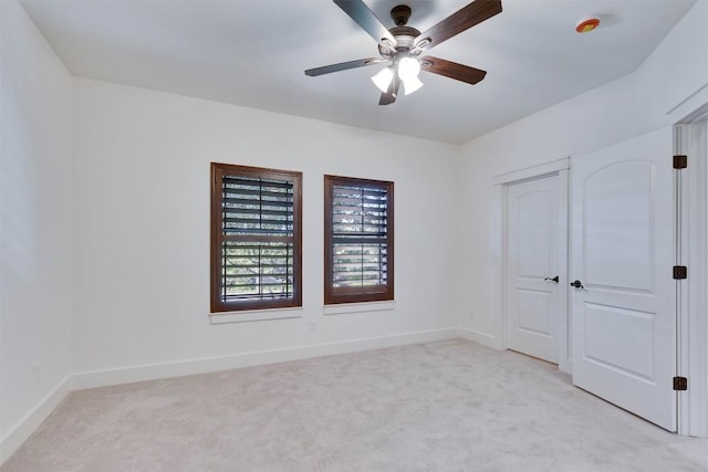 13601 Montview Dr, Austin, TX 78732 - unfurnished bedroom with light carpet and ceiling fan