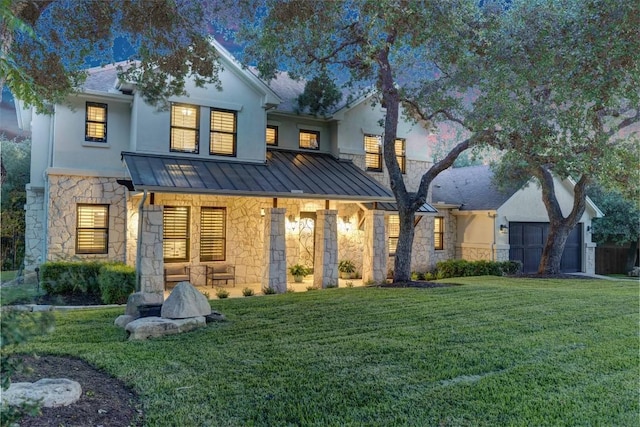 13601 Montview Dr, Austin, TX 78732 - rear view of property with stone siding, a standing seam roof, a lawn, a porch, and stucco siding