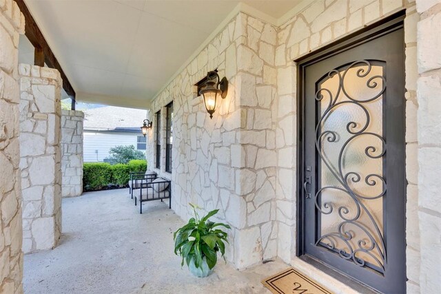 13601 Montview Dr, Austin, TX 78732 - property entrance featuring a porch and stone siding