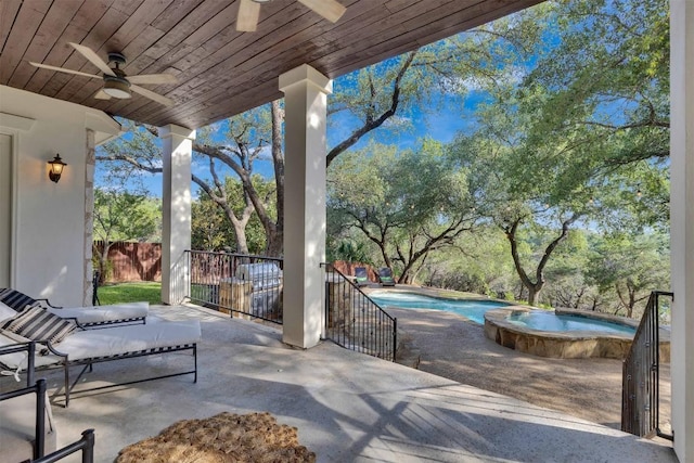 13601 Montview Dr, Austin, TX 78732 - view of patio / terrace with a ceiling fan, a pool with connected hot tub, and view of wooded area