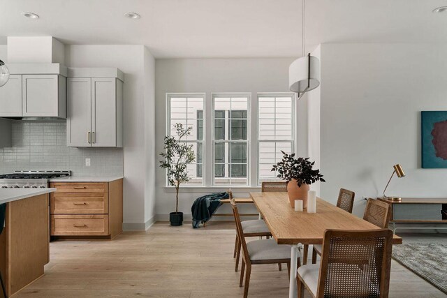 2209 Woodland Ave Unit 301, Austin, TX 78741 - dining area with light wood-type flooring, baseboards, and recessed lighting
