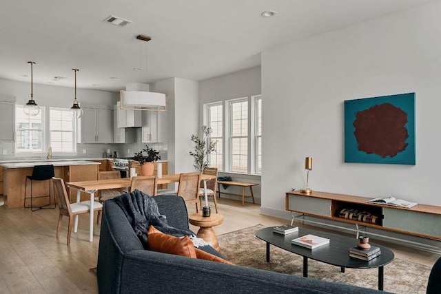 2209 Woodland Ave Unit 301, Austin, TX 78741 - living room with light wood-style floors and recessed lighting