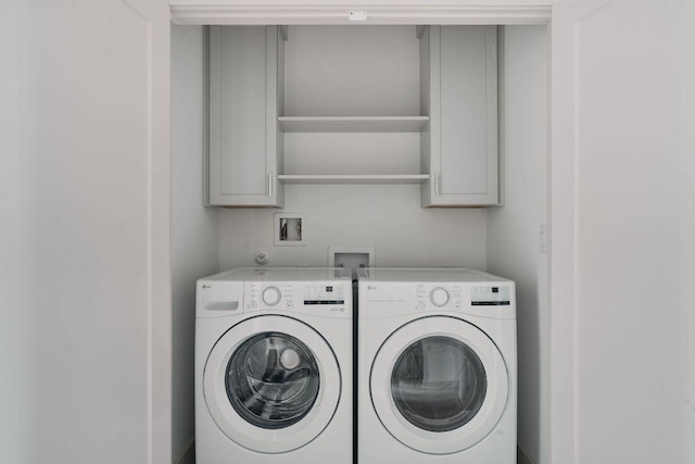 2209 Woodland Ave Unit 301, Austin, TX 78741 - washroom with cabinet space and washer and dryer
