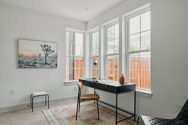 2209 Woodland Ave Unit 301, Austin, TX 78741 - office with plenty of natural light, wood finished floors, and baseboards