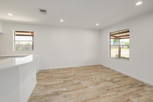 131 Roundup Dr, Liberty Hill, TX 78642 - empty room featuring light wood-type flooring, recessed lighting, and baseboards
