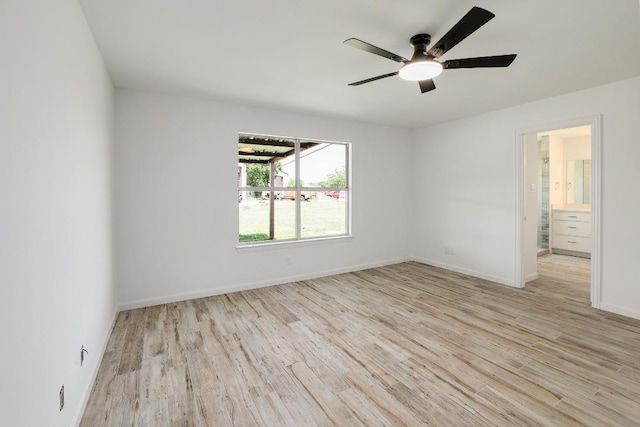 131 Roundup Dr, Liberty Hill, TX 78642 - spare room featuring wood finished floors, ceiling fan, and baseboards