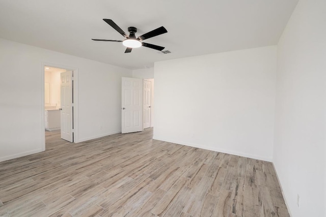 131 Roundup Dr, Liberty Hill, TX 78642 - spare room featuring light wood finished floors, ceiling fan, and baseboards