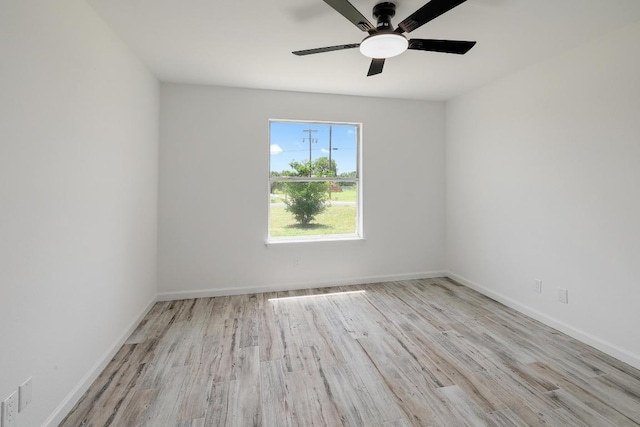 131 Roundup Dr, Liberty Hill, TX 78642 - spare room with wood finished floors, ceiling fan, and baseboards