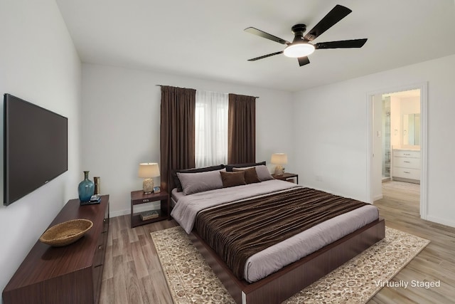 131 Roundup Dr, Liberty Hill, TX 78642 - bedroom with light wood-style flooring, baseboards, and a ceiling fan