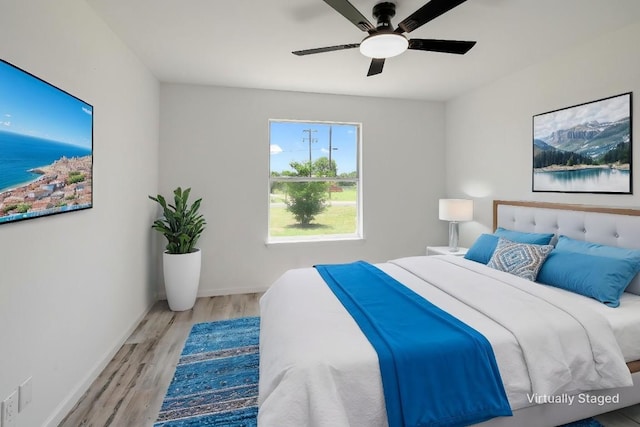 131 Roundup Dr, Liberty Hill, TX 78642 - bedroom featuring wood finished floors, baseboards, and ceiling fan