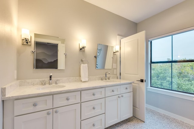 5904 Hudson Bend Rd, Austin, TX 78734 - full bath with plenty of natural light, double vanity, tile patterned floors, and baseboards