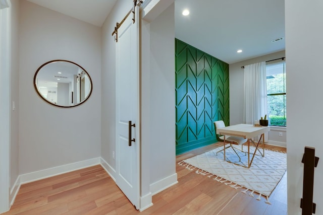 5904 Hudson Bend Rd, Austin, TX 78734 - office with a barn door, wood finished floors, recessed lighting, and baseboards