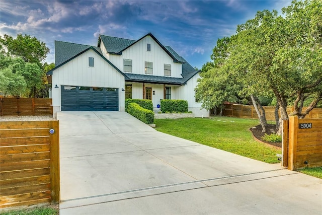 5904 Hudson Bend Rd, Austin, TX 78734 - modern inspired farmhouse featuring board and batten siding, driveway, a garage, and a shingled roof