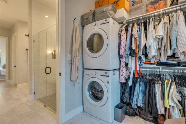 5904 Hudson Bend Rd, Austin, TX 78734 - laundry room with stacked washing machine and dryer and baseboards