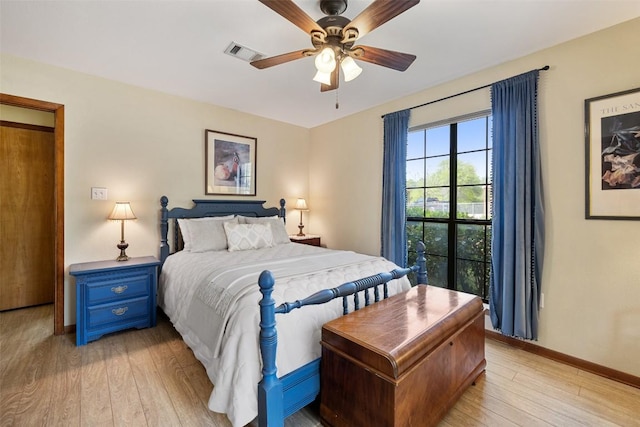 423 County Road 1010, Lampasas, TX 76550 - bedroom with light wood-style floors, baseboards, and ceiling fan