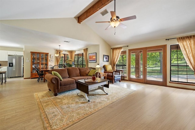 423 County Road 1010, Lampasas, TX 76550 - living area with beamed ceiling, light wood-style floors, a ceiling fan, and high vaulted ceiling