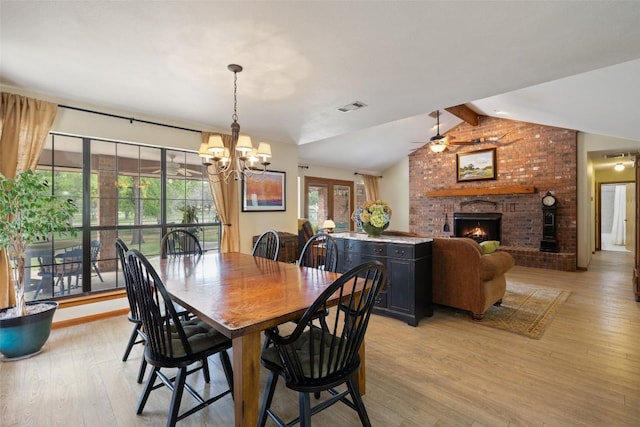423 County Road 1010, Lampasas, TX 76550 - dining area with light wood finished floors, a fireplace, and a ceiling fan
