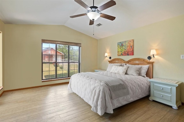 423 County Road 1010, Lampasas, TX 76550 - bedroom with light wood-type flooring, lofted ceiling, baseboards, and a ceiling fan