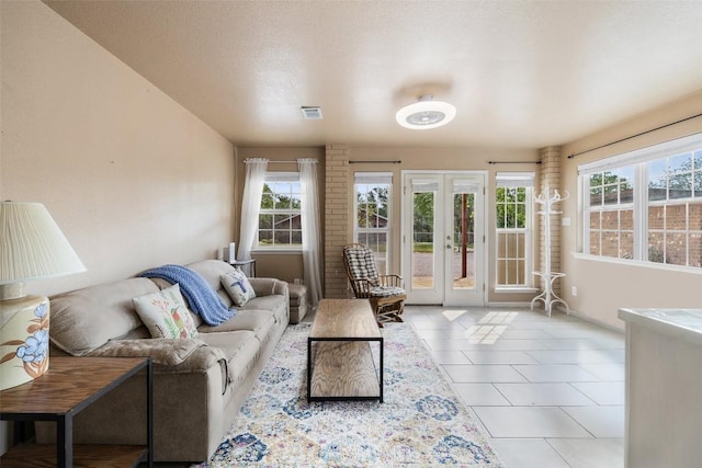 423 County Road 1010, Lampasas, TX 76550 - tiled living room with french doors, healthy amount of natural light, and baseboards