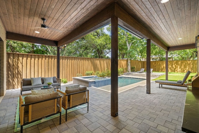 5615 Shoalwood Ave, Austin, TX 78756 - fenced backyard with a patio, outdoor lounge area, and a pool with connected hot tub