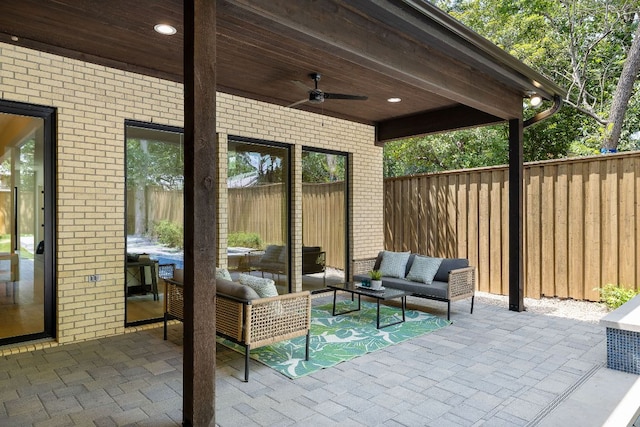 5615 Shoalwood Ave, Austin, TX 78756 - fenced backyard featuring outdoor lounge area, a ceiling fan, and a patio area